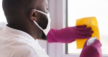 side-view-adult-male-disinfecting side-view-adult-male-disinfecting